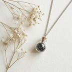 Sōma Maṇal silver — flat lay with dried flowers